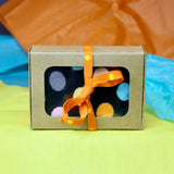 Mini treat box used without dividers for gift packaging for a pair of socks.