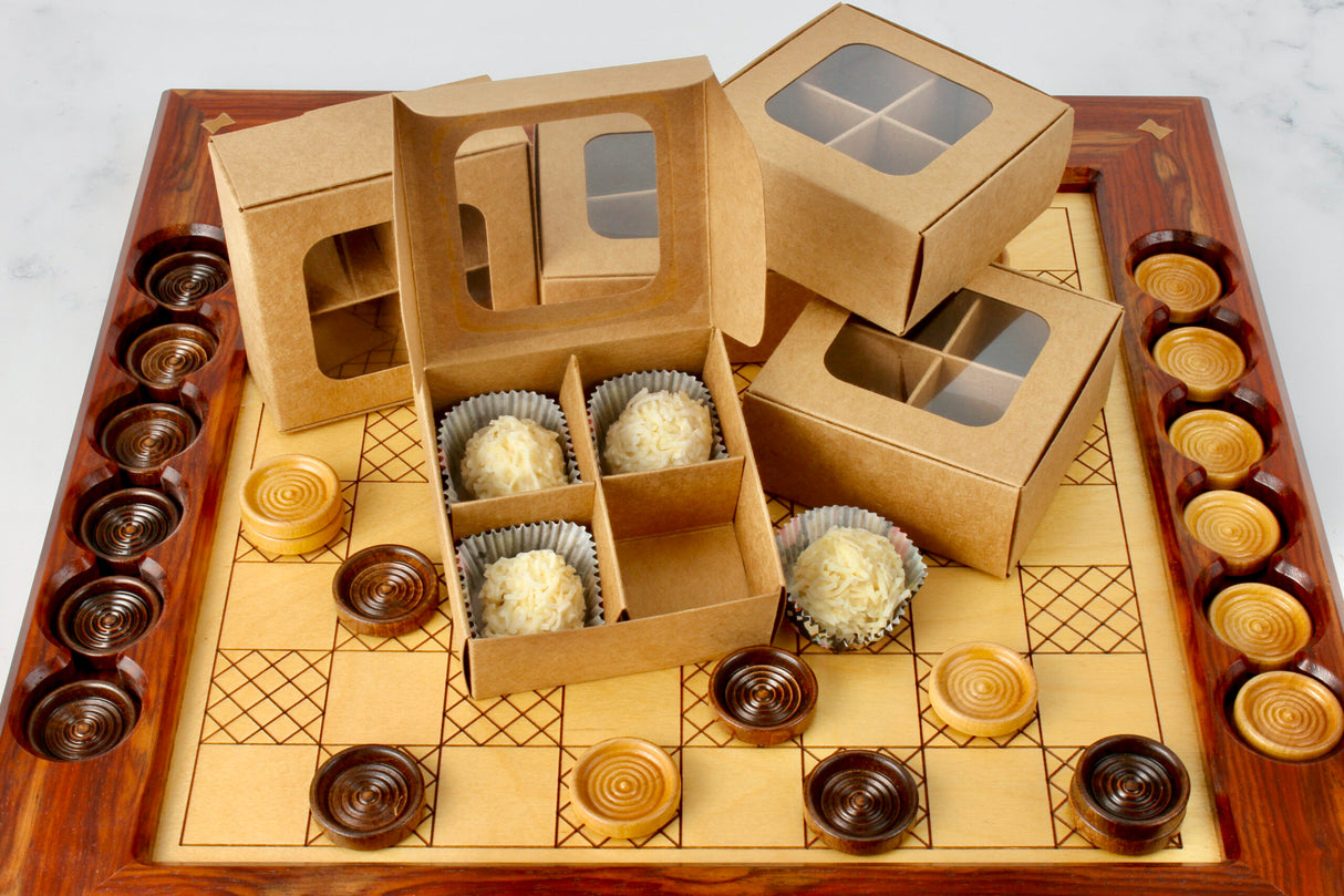 Mini treat box with dividers and window (four compartments) in kraft paper with white truffles on a checker board