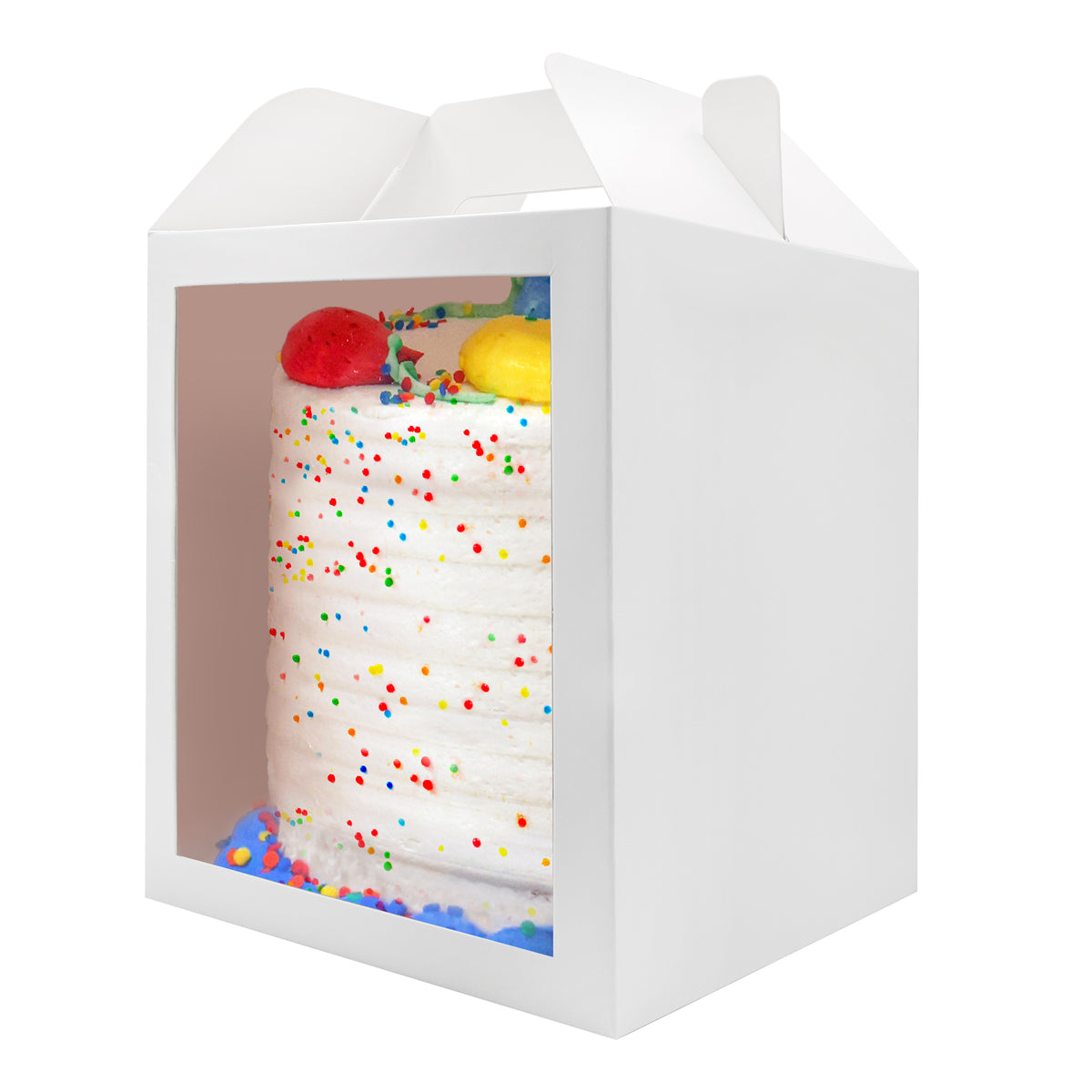 A cake in a 10x10x12 white paper cake box with window and handle, seen from an angle