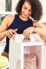 Closing a 10x10x12 white paper cake box with window and handle