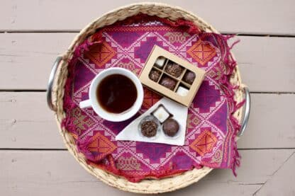 Mini truffle box with window and dividers (6 compartments) sitting on a tray with a cup of coffee